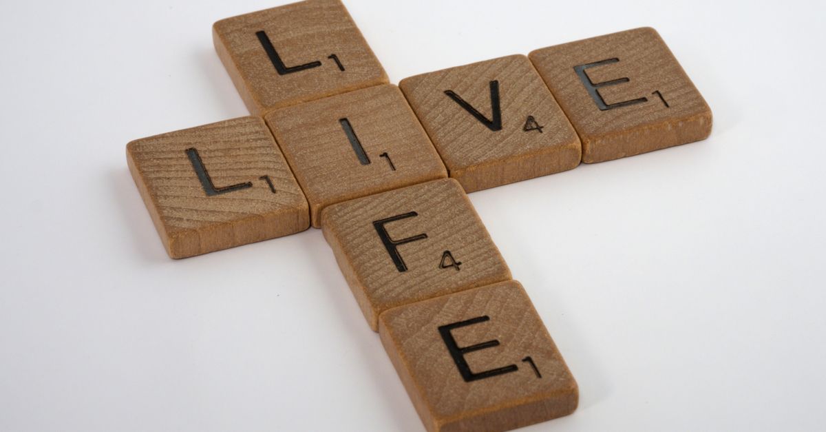 Close-up of Scrabble tiles on a white surface