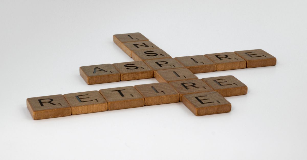 Brown wooden Scrabble tiles on white