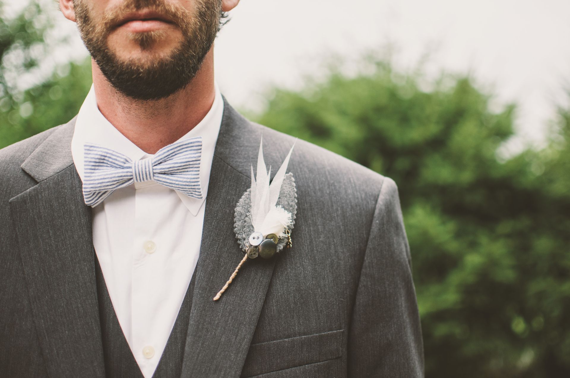 Man wearing an elegant gray and white tuxedo