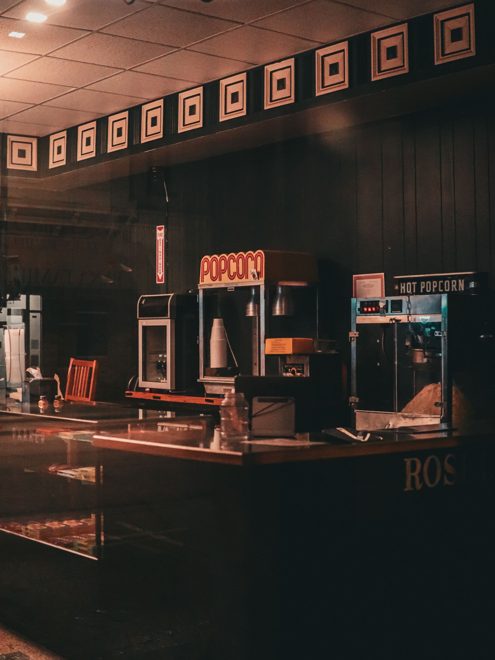 Retro movie theater concession stand with popcorn machines