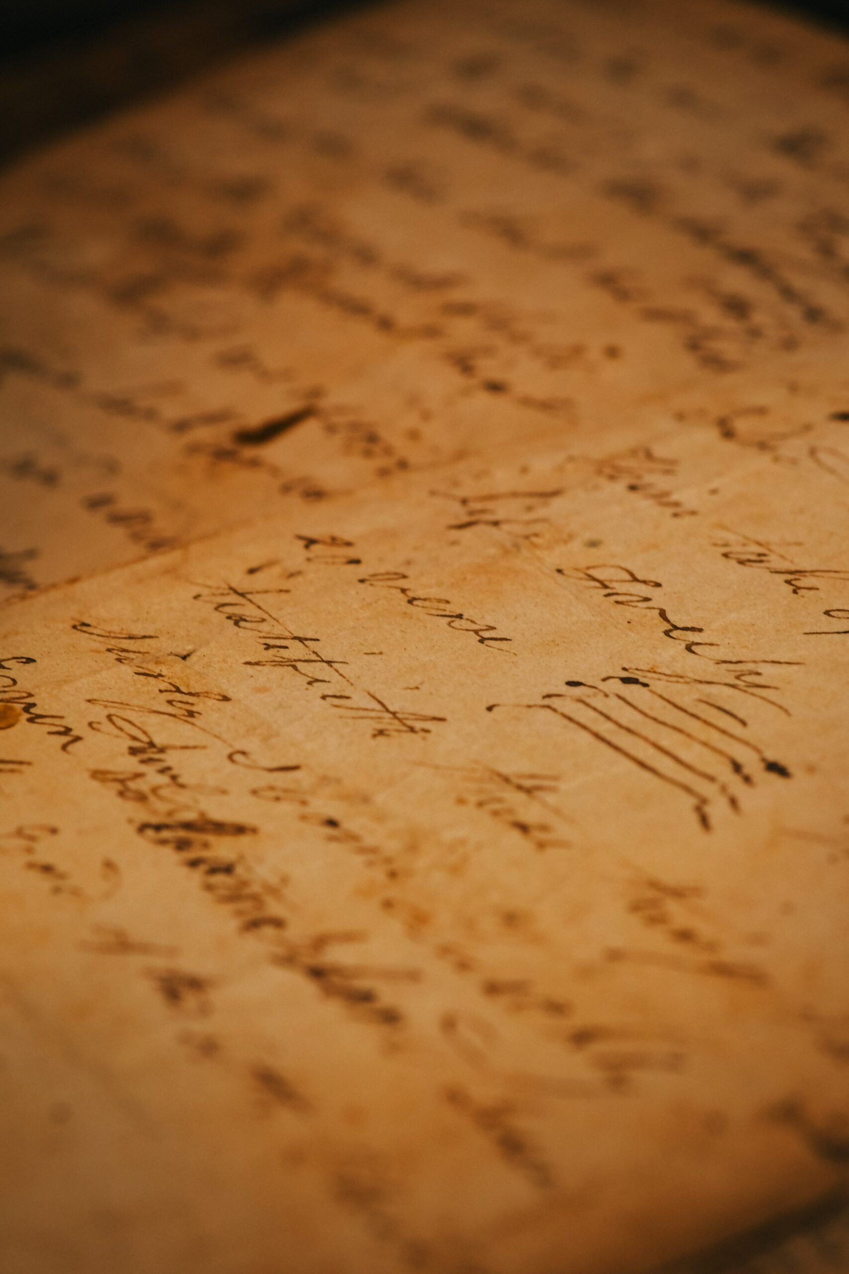 Close-up of an antique handwritten document with cursive writing